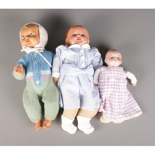 166 - A trio of ceramic dolls including Armand Marseille bisque doll and Pedigree example.