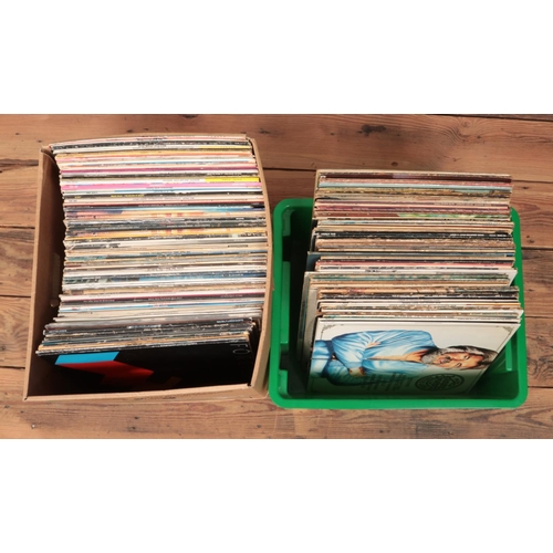 216 - Two boxes of rock, pop and county vinyl records. To include Queen, Bryan Adams, Barry White, Diana R... 