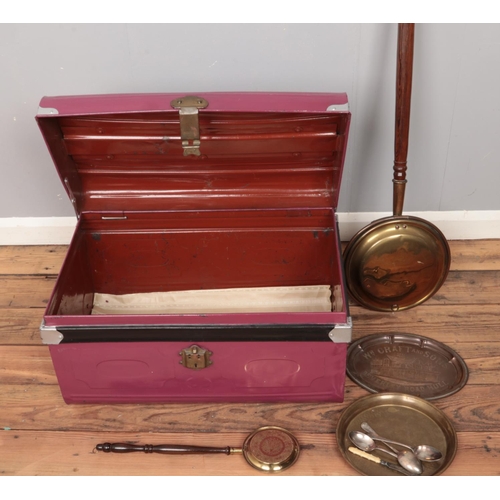 279 - A large purple tin trunk along with assorted metal wares such as warming pan and decorative trays.