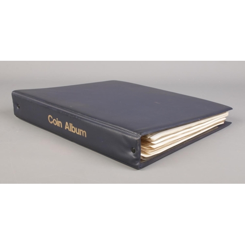 64 - A large coin album containing a good collection of pre-decimal coins. To include half crowns, silver... 