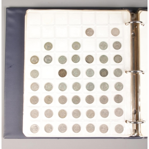 64 - A large coin album containing a good collection of pre-decimal coins. To include half crowns, silver... 