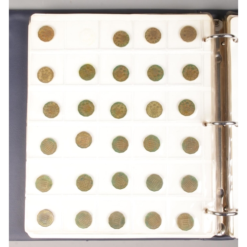 64 - A large coin album containing a good collection of pre-decimal coins. To include half crowns, silver... 