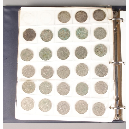 64 - A large coin album containing a good collection of pre-decimal coins. To include half crowns, silver... 