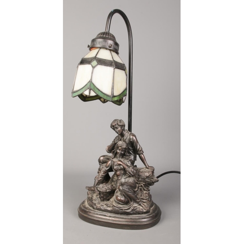 67 - A composite figural tiffany style table lamp. Stamped Crosa 2005 to the back. 47cm high.