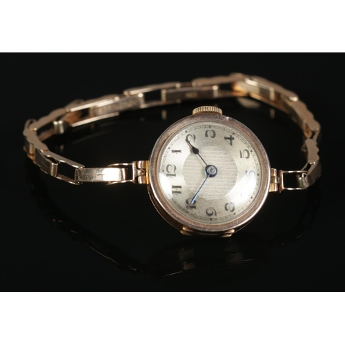 313 - A ladies 9ct Gold cocktail watch, with 9ct Gold 'Springbok' strap.