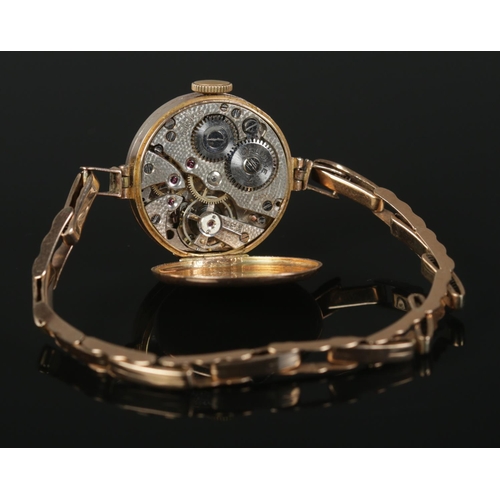 313 - A ladies 9ct Gold cocktail watch, with 9ct Gold 'Springbok' strap.