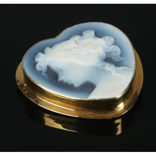 314 - A hardstone cameo pendant/brooch, formed within an 18ct Gold heart-shaped mount.