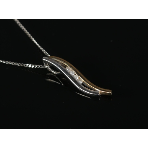 316 - A 9ct Gold, White Gold and Diamond pendant on 9ct White Gold chain.