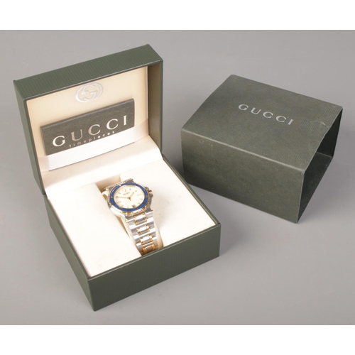 328 - A boxed gents bi metal Gucci 9700M quartz wristwatch.