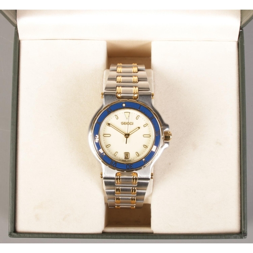 328 - A boxed gents bi metal Gucci 9700M quartz wristwatch.