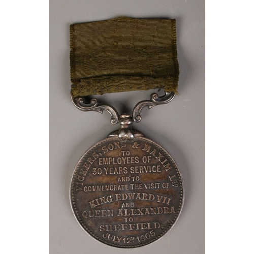 337 - An Edward VII commemorative medal. Awarded to the employees of Vickers Sons & Maxim Limited for 30 y... 