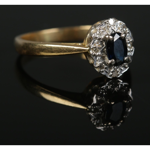 362 - An 18ct Gold, Sapphire and Diamond cluster ring. Size N. Total weight: 3.72g