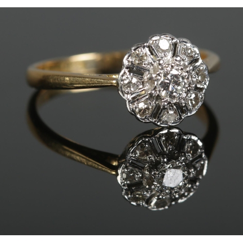 364 - A mid twentieth century 18ct Gold and Platinum Diamond cluster ring, with central brilliant cut ston... 