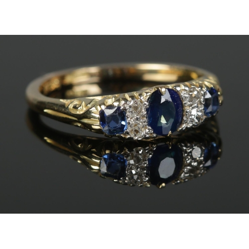 370 - An 18ct Gold, Platinum Sapphire and Diamond seven stone ring. Size L½. Total weight: 3.36g