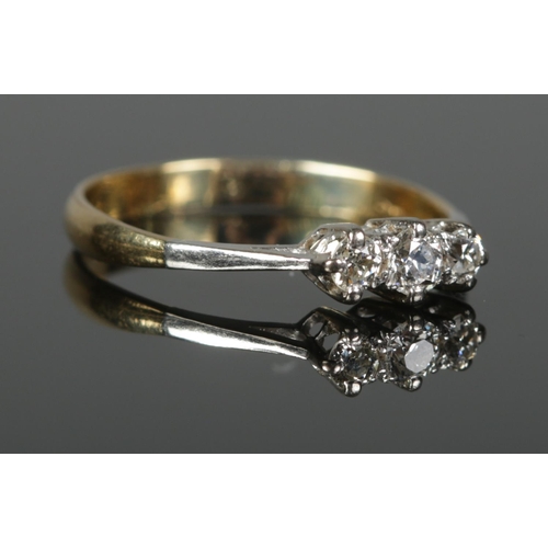 372 - An 18ct Gold and Platinum three stone diamond ring. Size S. Total weight: 2.82g