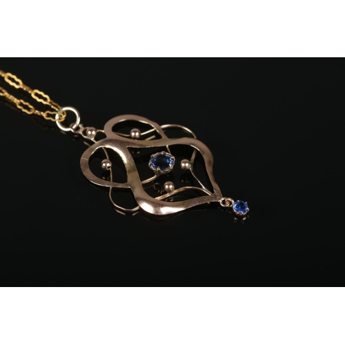 375 - A 9ct Gold nouveau pendant, set with central and droplet blue stones, on 9ct Gold chain. Total weigh... 