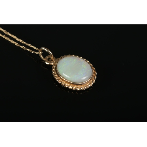 376 - A 9ct Gold Opal pendant, on dainty 9ct Gold chain. Total weight: 1.41g.