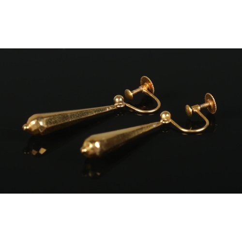 380 - A pair of 9ct Gold pendant drop earrings, with screw backs. Total weight: 1.55g