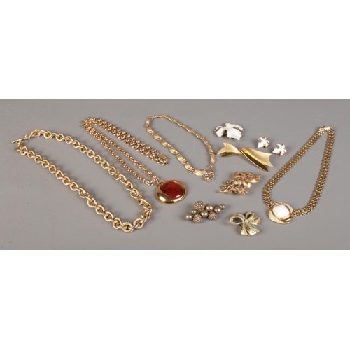 388 - A collection of costume jewellery. To include Trifari necklaces, Monet brooch and brooch and clip on... 