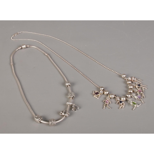 390 - A silver Pandora necklace with charms, together with a silver dolly necklace.