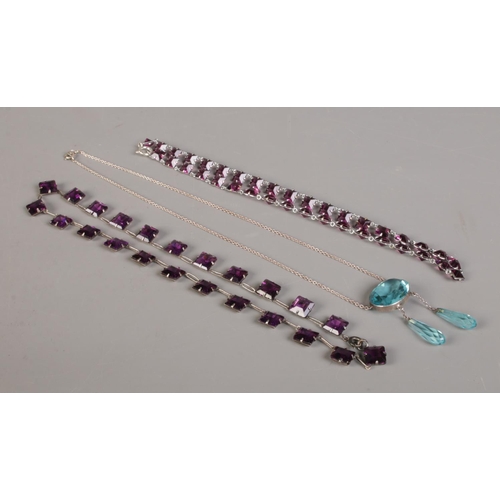 404 - Three vintage paste necklets, to include amethyst coloured examples.