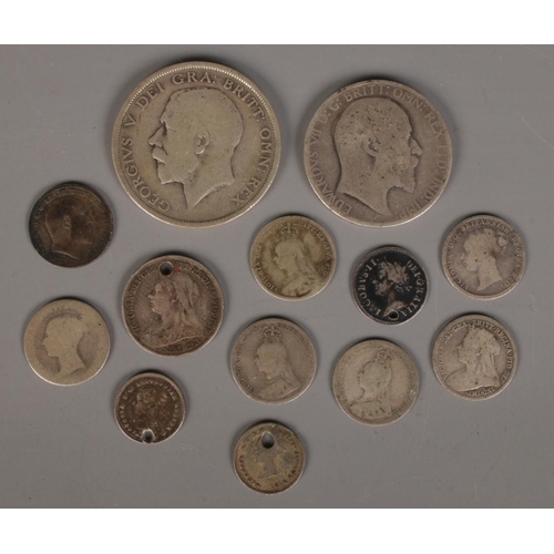 409 - A small quantity of silver coins. Including 1919 half crown, James II 1686 two pence, etc. 39.33g.