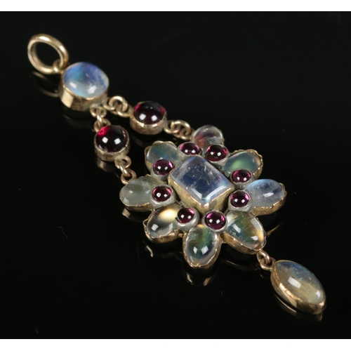 413 - A 9ct gold moonstone and garnet pendant. 3.81g.