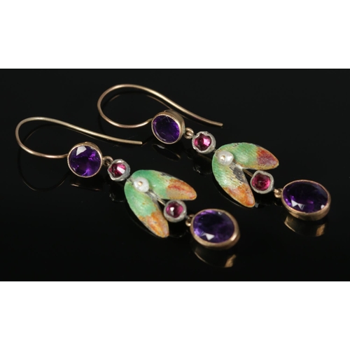 415 - A pair of yellow and white metal earrings with enamel decoration and amethyst coloured stones. 3.85g... 