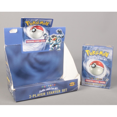 444 - A boxed Pokémon full and sealed Base Set 2-Player Starter Deck along with original starter set displ... 