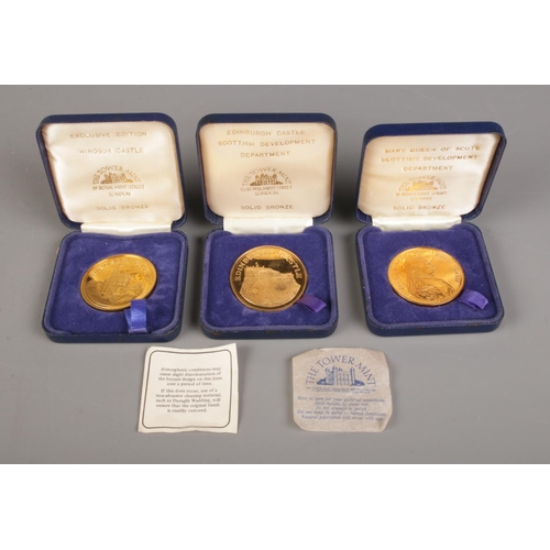 464 - The Tower Mint; Three solid bronze medallions depicting Windsor Castle, Edinburgh Castle and Mary Qu... 