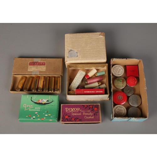 89 - A quantity of cosmetic items including rouge pots, lipsticks and bath blossoms.