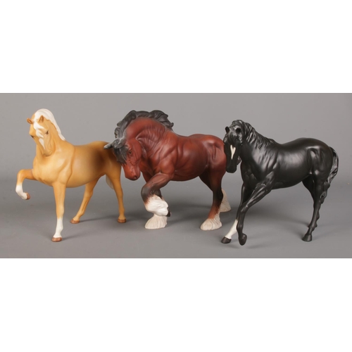 466 - Three Beswick horses. Includes shire horse, palomino and Black Beauty.