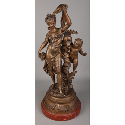 93 - Par Bruchon, A French spelter figure group of a maiden and cherub. Titled 'La Source'. (60cm)