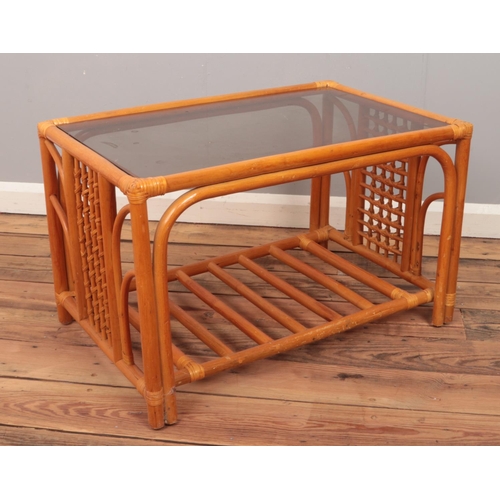 468 - A bamboo effect coffee table with smoked glass top.