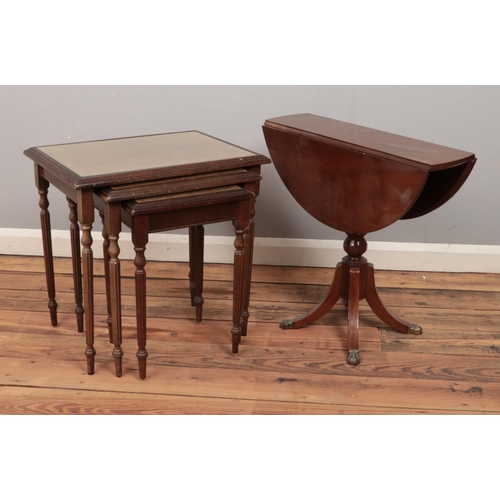 471 - A nest of three mahogany tables along with a small drop leaf occasional table.