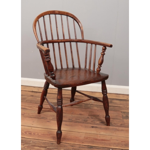 472 - A 19th century ash/elm Windsor arm chair.