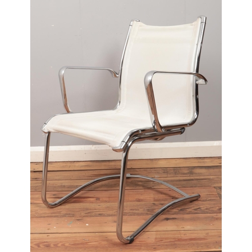 474 - A chrome easy arm chair.