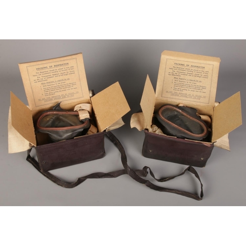 99 - Two cased and boxed WWII gas masks.