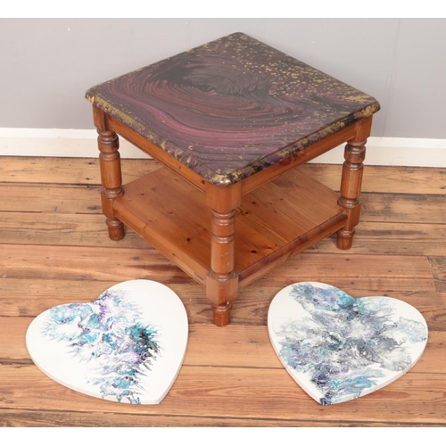 486 - A pine coffee table with painted and varnished top along with two heart shaped oil on canvas.