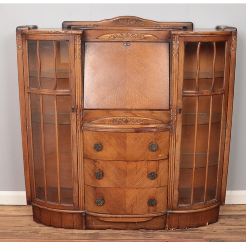 488 - An oak side by side bureau. (120cm x 125cm)