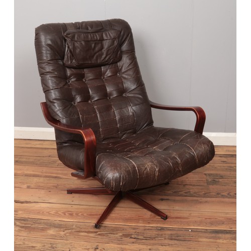 506 - A bentwood easy chair with leather upholstery and metal base.