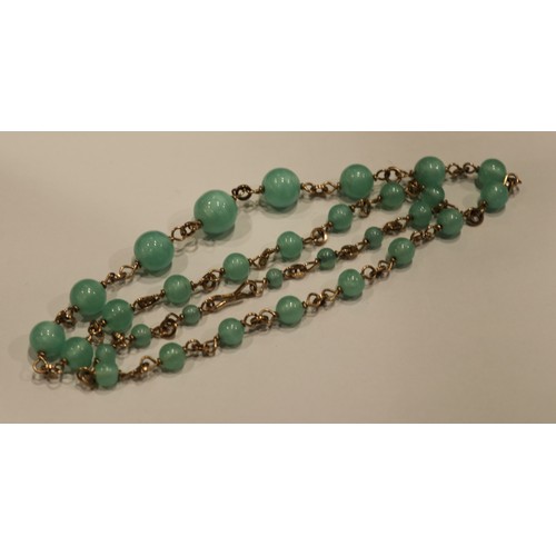 382 - A collection of Peking Glass jewellery. To include necklace, large brooch and carved bracelet.