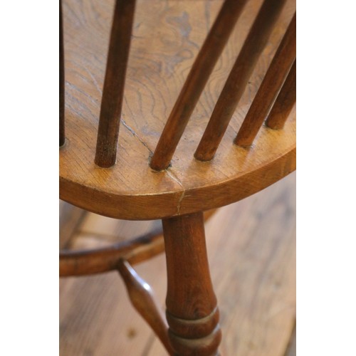 503 - An ash/elm Windsor arm chair, with pierced splat and end turned supports.