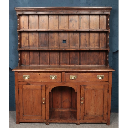 477 - A Nineteenth century pine dresser, with two drawers and cupboard doors to the base. Height: 177cm, W... 