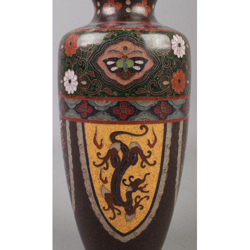 3 - A Japanese cloisonne vase with dragon and phoenix decoration. 18cm.