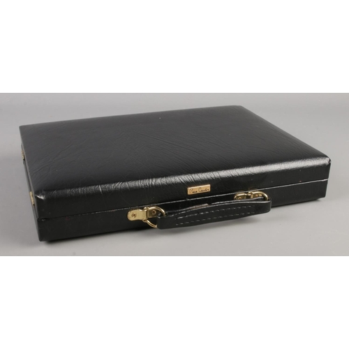 60 - A Pierre Cardin case containing a large collection of Sheffield Wednesday pin badges and brooches (a... 