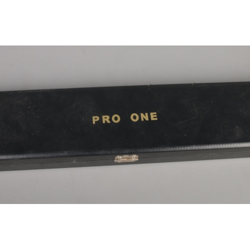 67 - A cased Pro One three piece snooker cue.