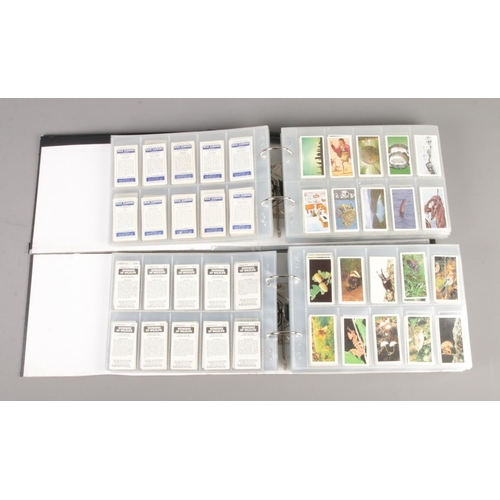 86 - Three large albums containing over 3000 Brooke Bond tea cards, together with an album containing Hen... 