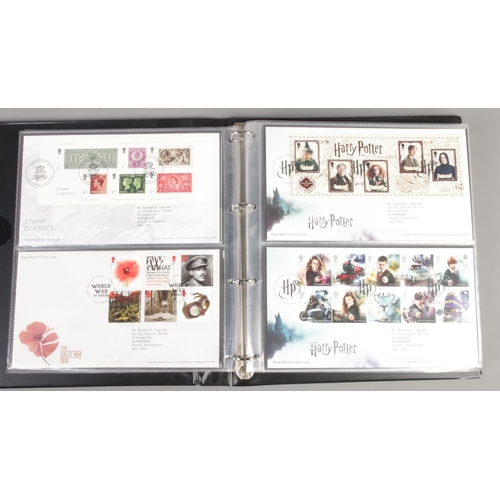 93 - An album of Royal Mail first day covers. Including Marvel, Harry Potter, David Bowie, Pink Floyd, et... 