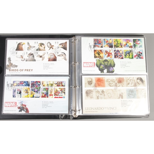 93 - An album of Royal Mail first day covers. Including Marvel, Harry Potter, David Bowie, Pink Floyd, et... 